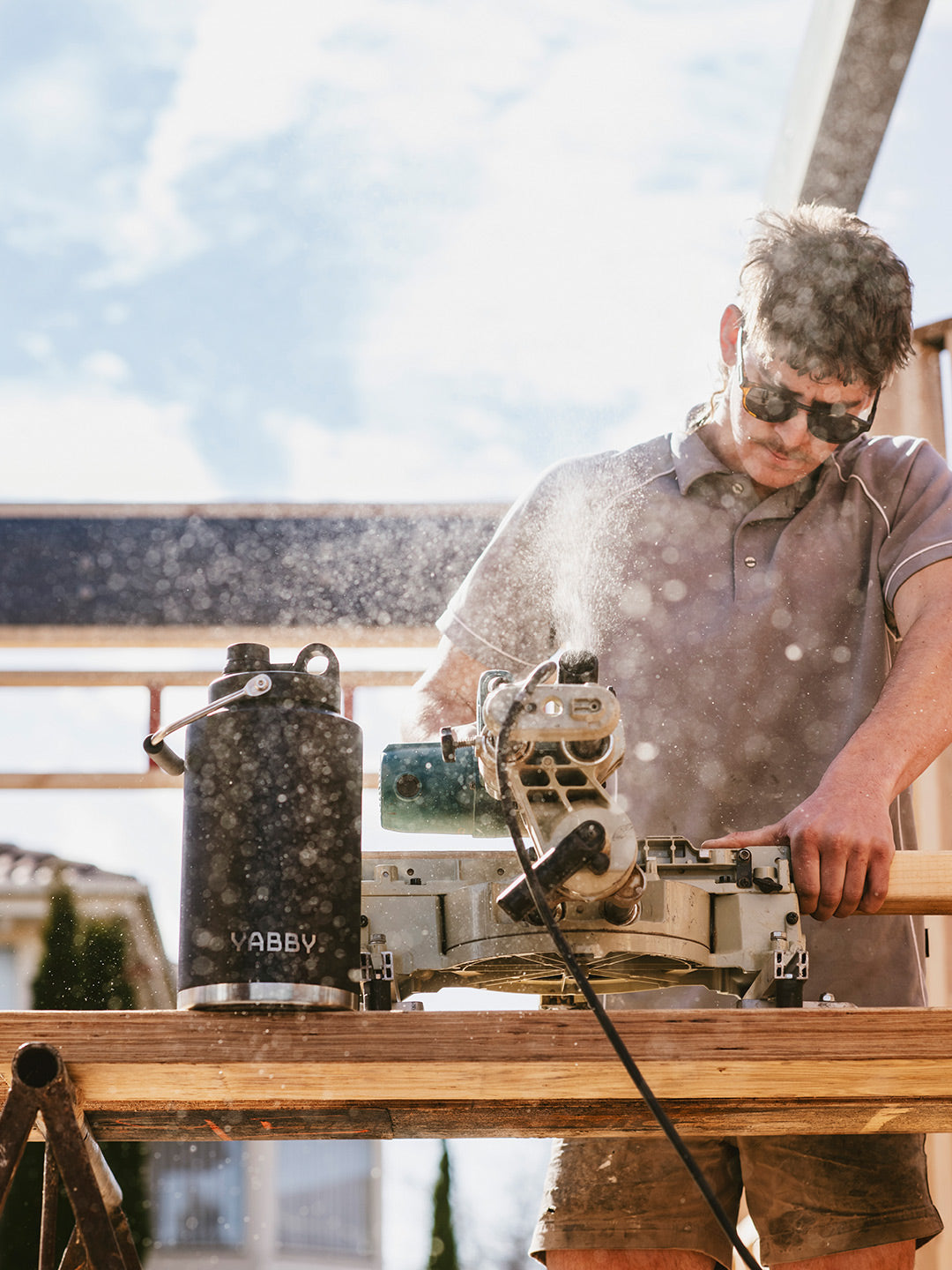 3.8 Litre Yabby Black Jug Insulated Stainless Steel. Tradie working on site outdoors. Triple Wall. Keep Hot and Cold for longer. Best Black Jug Australia.