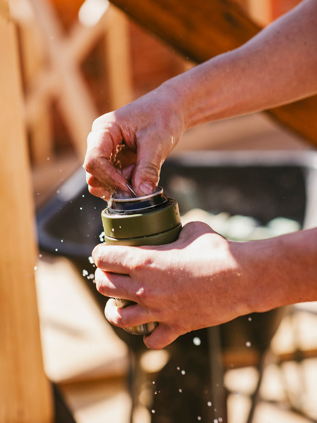 Crack opening a Can of Drink in an Insulated Stubby Holder & Can Cooler that keeps drinks icy cold. By Yabby Outdoors Australia.