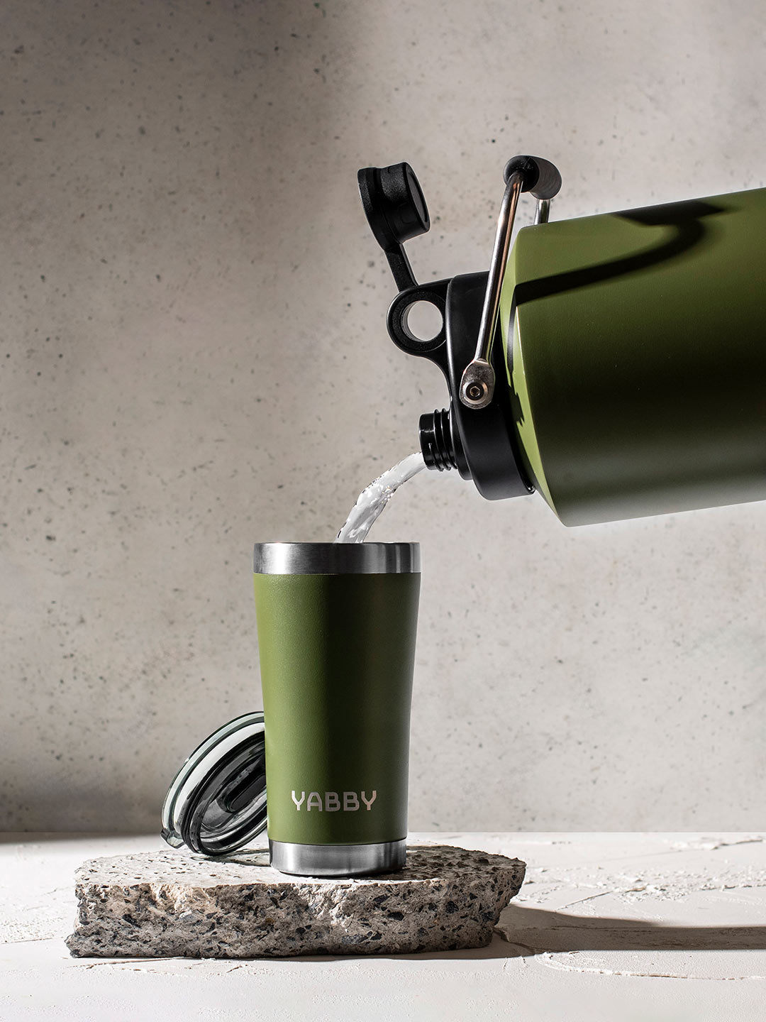 Pouring coffee and hot water into the Best Coffee Tumbler in Australia. Insulated Stainless Steel in Black with Triple wall to keep drinks hot and cold for longer. By Yabby Outdoors.
